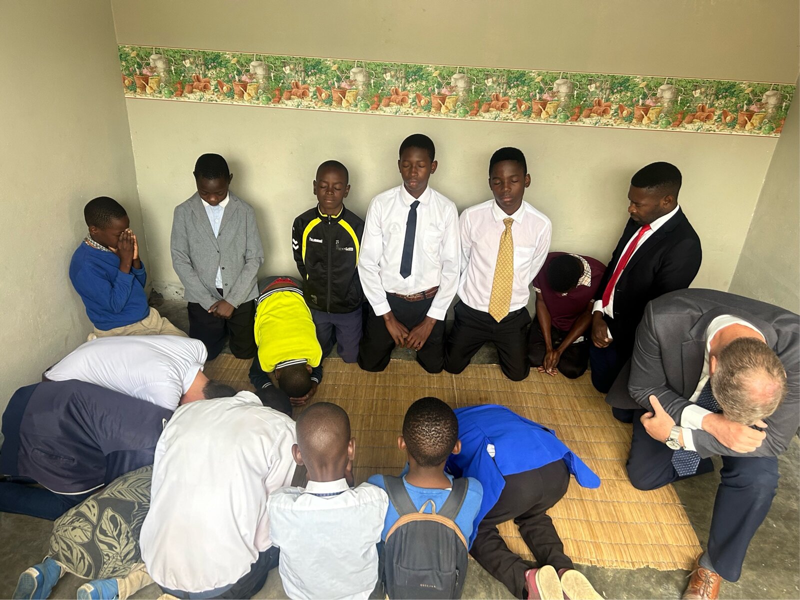 Young men praying together
