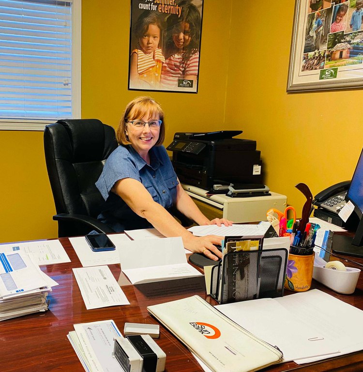 Allison Broc at her desk in the home office