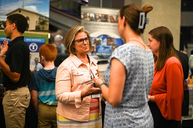 Vicki Taylor talking with visitors