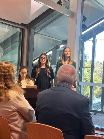 Ladies singing together during a service in Australia.